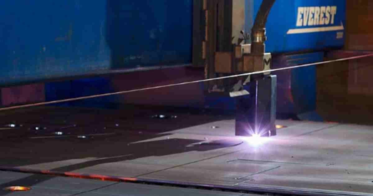 Automated plasma cutting system cutting through metal sheets.